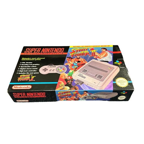 355A - A boxed PAL version of the Street Fighter 2 SNES Super Nintendo Console, complete with the iconic St... 