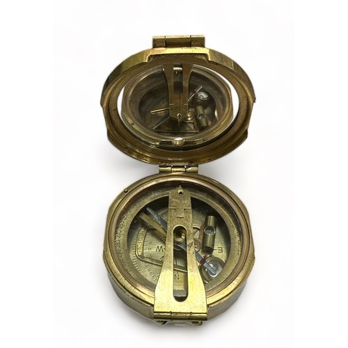 119 - Brass Ships Compass housed in an attractive wooden box with anchor Cartouche.