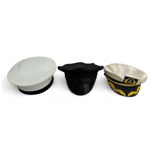 78 - Collection of Military Hats and caps to include two pilots caps, one green beret, one Russian cap, o... 