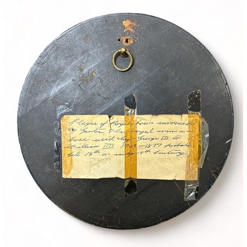 77 - Circular Wooden Plaque Depicting Royal Arms. Label attached to rear reads 