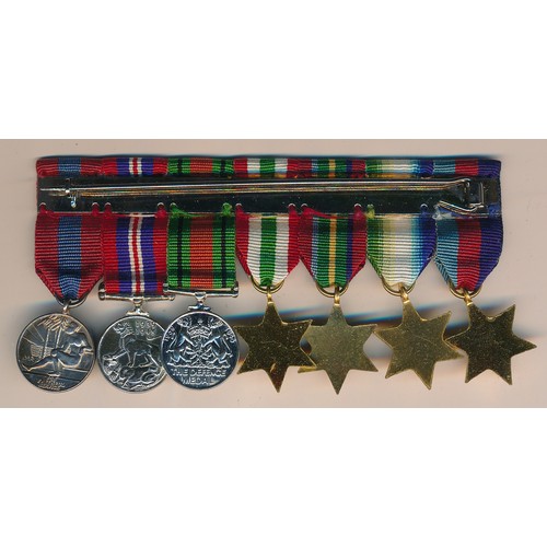 36 - Group of seven miniature medals with 1939-1945 Star, Atlantic Star, Pacific Star, Italy Star, Defenc... 