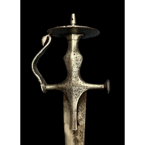 56 - 19th Century Indo-Persian Swords. Early 19th Century Indian Tulwar: Featuring a 31-inch, slightly cu... 