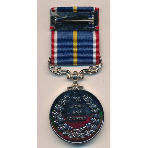 31 - A boxed National Service medal to 5384452 SPR E. POWELL RE.