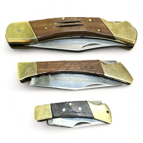 84A - Three stainless steel lock knives in graduating sizes, blade lengths measuring 9.5cm, 8.5cm & 4.5cm.... 