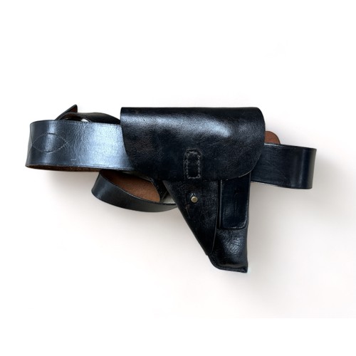 76A - Black leather Sam Browne belt with revolver holster.