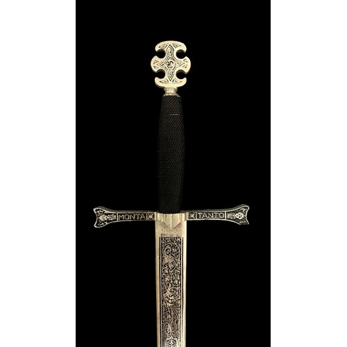 57A - A Pair Of Replica Swords. A Excalibur styled sword with 'Tanto Monta' inscribed. Believed to be styl... 