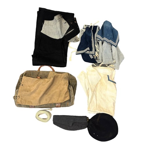 74A - Royal Navy Uniform In Kit Bag. A Royal Navy uniform including trousers, tunic, hats and duffle sack.... 