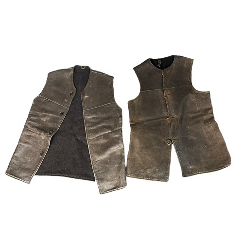 75A - Military Leather Jerkins. Two leather jerkins with buttons. Also a pair of leather mittens, a pair o... 