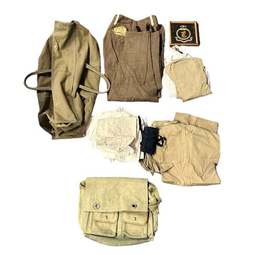 77A - Two Military Kit Bags With Various Uniforms. Various military trousers, button shirts and a satchel.... 