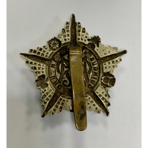 89A - Machine Gun Guards cap badge circa 1917-18. Good scarce die-stamped white metal crowned GMR cypher i... 