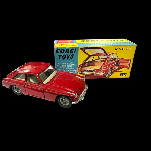 190 - Corgi MGB GT dark red with light blue interior, wire wheels and black suitcase No. 327, generally ex... 