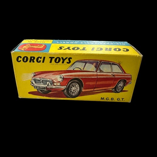 190 - Corgi MGB GT dark red with light blue interior, wire wheels and black suitcase No. 327, generally ex... 