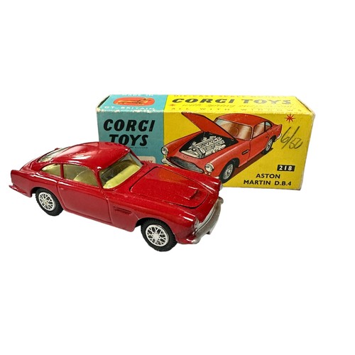 118 - Corgi Aston Martin DB4 red with lemon interior and accessory decal wheels) No. 218, generally excell... 