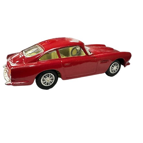 118 - Corgi Aston Martin DB4 red with lemon interior and accessory decal wheels) No. 218, generally excell... 