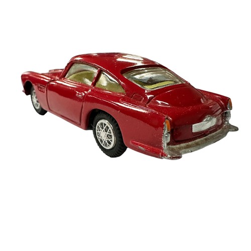 118 - Corgi Aston Martin DB4 red with lemon interior and accessory decal wheels) No. 218, generally excell... 