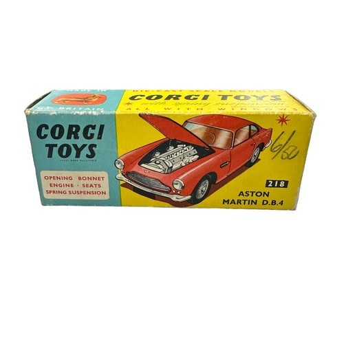 118 - Corgi Aston Martin DB4 red with lemon interior and accessory decal wheels) No. 218, generally excell... 