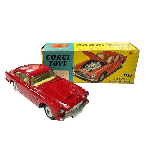 120 - Corgi Aston Martin DB4 red with lemon interior and spun hubs No. 218, generally excellent to good pl... 