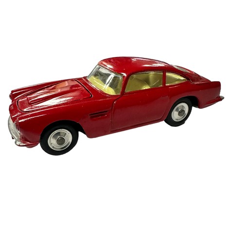 120 - Corgi Aston Martin DB4 red with lemon interior and spun hubs No. 218, generally excellent to good pl... 