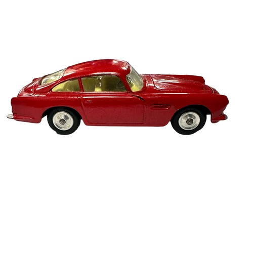 120 - Corgi Aston Martin DB4 red with lemon interior and spun hubs No. 218, generally excellent to good pl... 