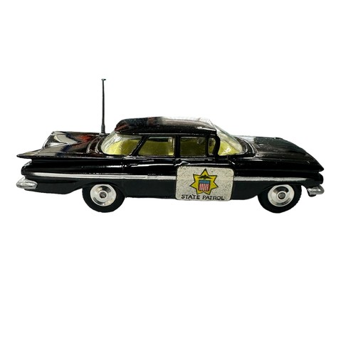 124 - Corgi Chevrolet State Patrol with intact and straight aerial No. 223, generally excellent in good pl... 