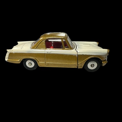 132 - Corgi Triumph Herald Coupe metallic gold and white with red interior No. 231, generally excellent in... 