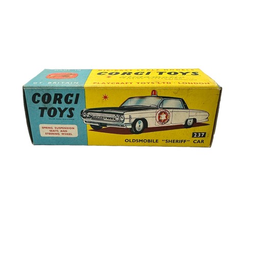 136 - Corgi Oldsmobile County Sheriff black and white No. 237, generally excellent in good plus box (penci... 