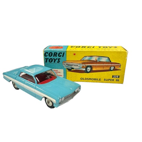 134 - Corgi Oldsmobile Super 88 pale blue and white stripe with red interior No. 235, generally excellent ... 