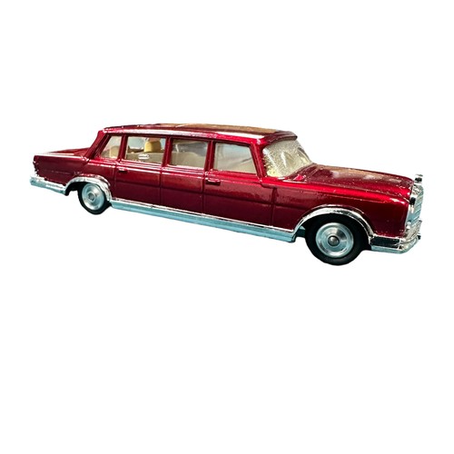 144 - Corgi Mercedes-Benz 600 No. 247, generally excellent in excellent box, metallic dark red with cream ... 