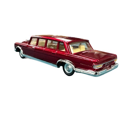 144 - Corgi Mercedes-Benz 600 No. 247, generally excellent in excellent box, metallic dark red with cream ... 