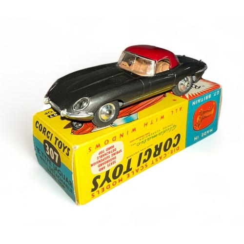 173 - Corgi Jaguar E-Type No. 307, grey with detachable maroon hard top, tan interior, spun hubs, generall... 