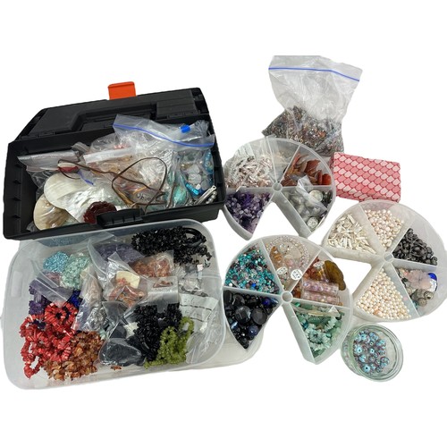 67 - A large assortment of loose and strung beads, cultured pearls, gemstones and other jewellery making ... 