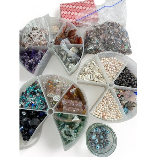 67 - A large assortment of loose and strung beads, cultured pearls, gemstones and other jewellery making ... 