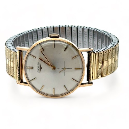 68 - Longines gents 9ct gold watch. Silvered dial with baton hour markers and sub seconds dial.  Inscribe... 