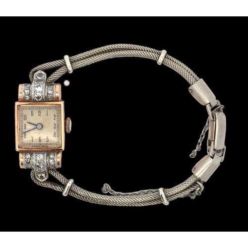 70 - A ladies 18ct gold and diamond cocktail watch, hallmarks to inner case, on an unmarked metal bracele... 