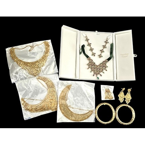 64A - Gold plated Indian style jewellery. A selection of items include necklaces, earrings, bangles etc, s... 