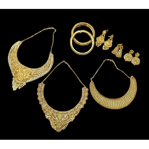 64A - Gold plated Indian style jewellery. A selection of items include necklaces, earrings, bangles etc, s... 