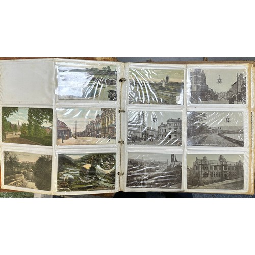 409 - An early to mid 20th Century range of postcards (198) in an an album, in mixed condition, with stree... 