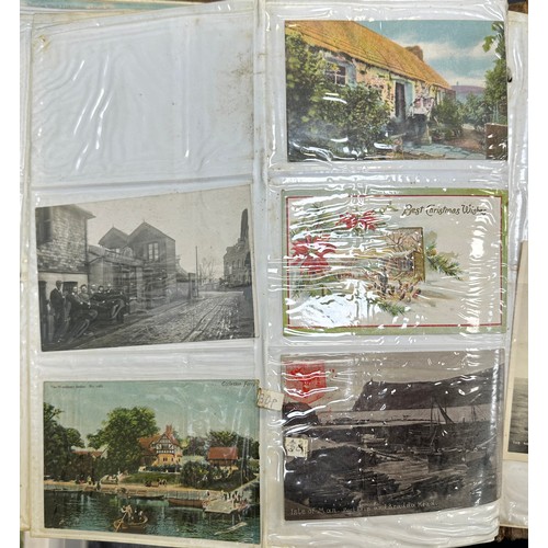 409 - An early to mid 20th Century range of postcards (198) in an an album, in mixed condition, with stree... 