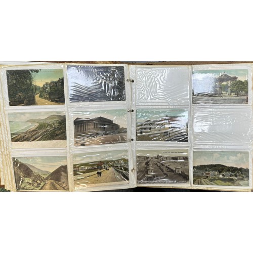 409 - An early to mid 20th Century range of postcards (198) in an an album, in mixed condition, with stree... 