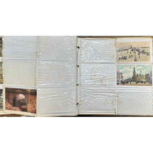 409 - An early to mid 20th Century range of postcards (198) in an an album, in mixed condition, with stree... 