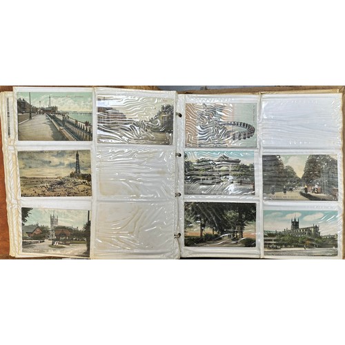 409 - An early to mid 20th Century range of postcards (198) in an an album, in mixed condition, with stree... 