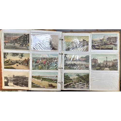 409 - An early to mid 20th Century range of postcards (198) in an an album, in mixed condition, with stree... 