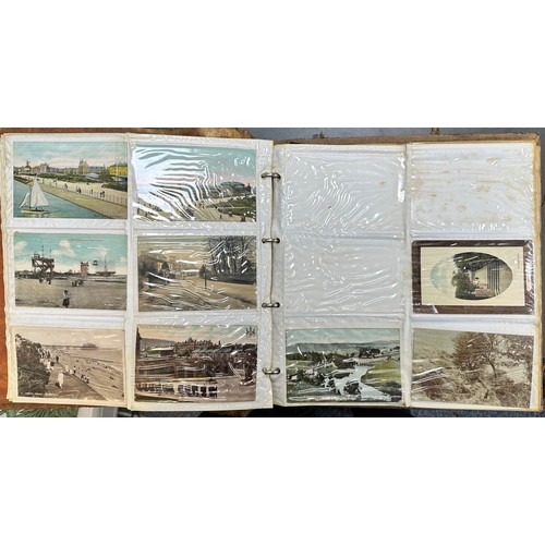 409 - An early to mid 20th Century range of postcards (198) in an an album, in mixed condition, with stree... 