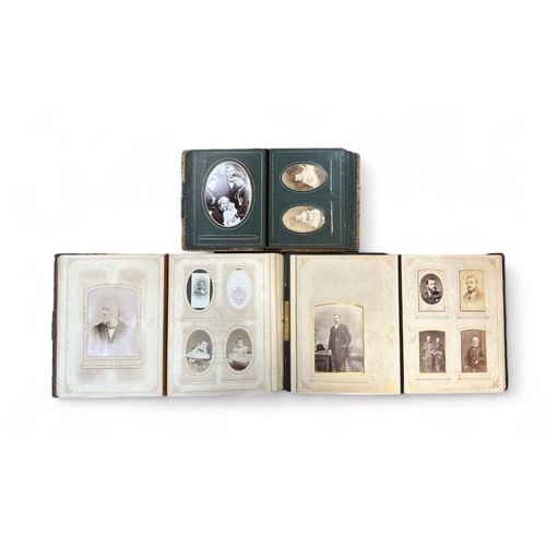 411 - A collection of Victorian photographic cabinet cards / Cartes de Visite, with 151 cards in 3 contemp... 