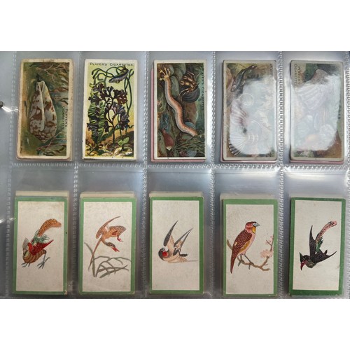 289 - Collection of cigarette cards, part sets and type cards in plastic sleeves, in an album, in mixed co... 