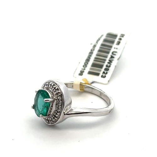 60 - A Siberian emerald and diamond white 9ct gold ring with attached tag and Certifcate of Authenticity.... 