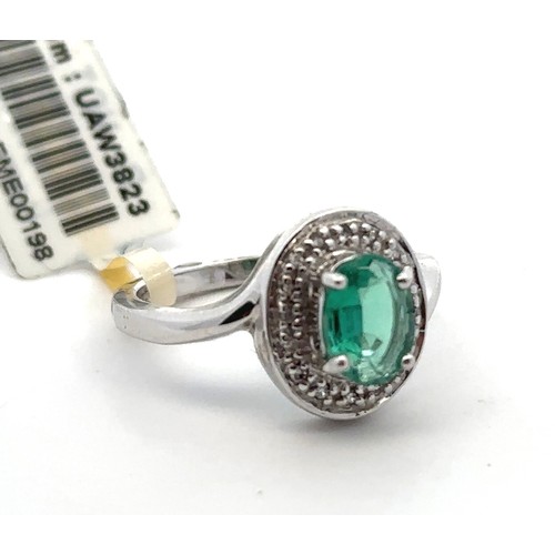 60 - A Siberian emerald and diamond white 9ct gold ring with attached tag and Certifcate of Authenticity.... 