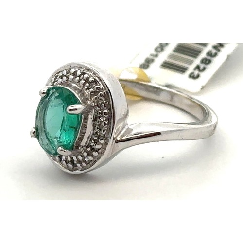 60 - A Siberian emerald and diamond white 9ct gold ring with attached tag and Certifcate of Authenticity.... 