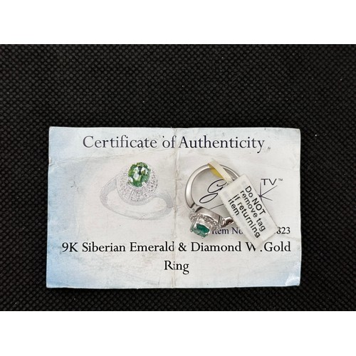 60 - A Siberian emerald and diamond white 9ct gold ring with attached tag and Certifcate of Authenticity.... 