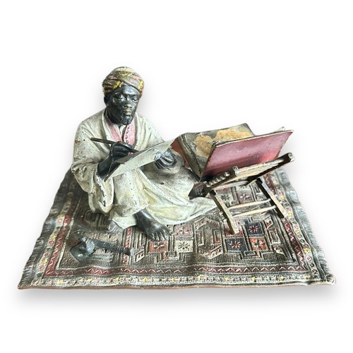 384 - Franz Bergman (Austrian, 1861-1936), late 19th century, cast as an Arab scribe seated on a carpet, t... 